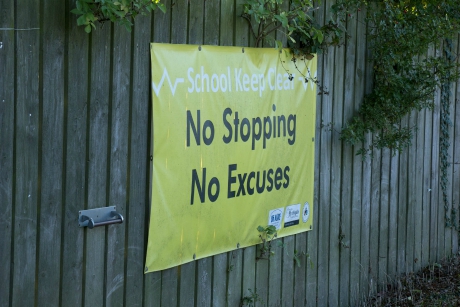 No Stopping, No Excuses sign outside a school