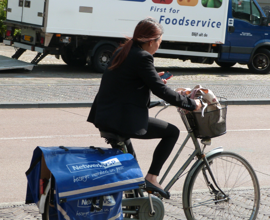 Cyclist using mobile phone, Utrecht