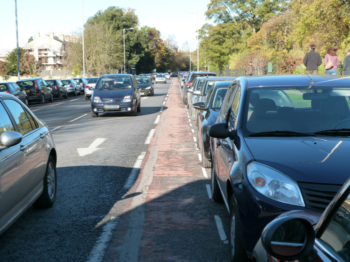 Cycle lane by parked cars