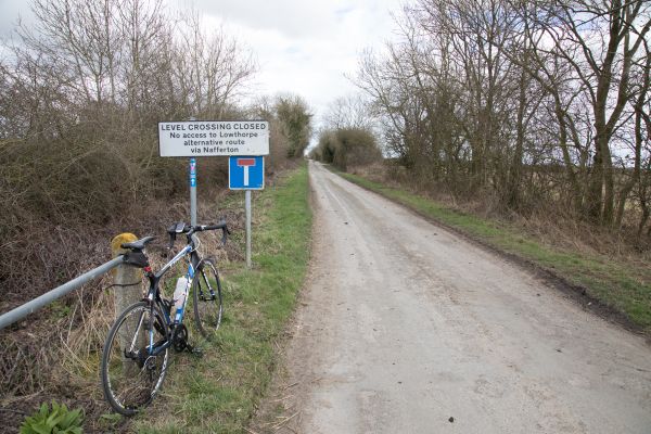 Misleading sign about Outgate level crossing