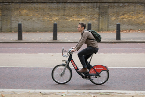 Person riding Santander cycle in London