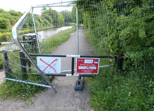 Barrier & signs on canal path to Rotherham