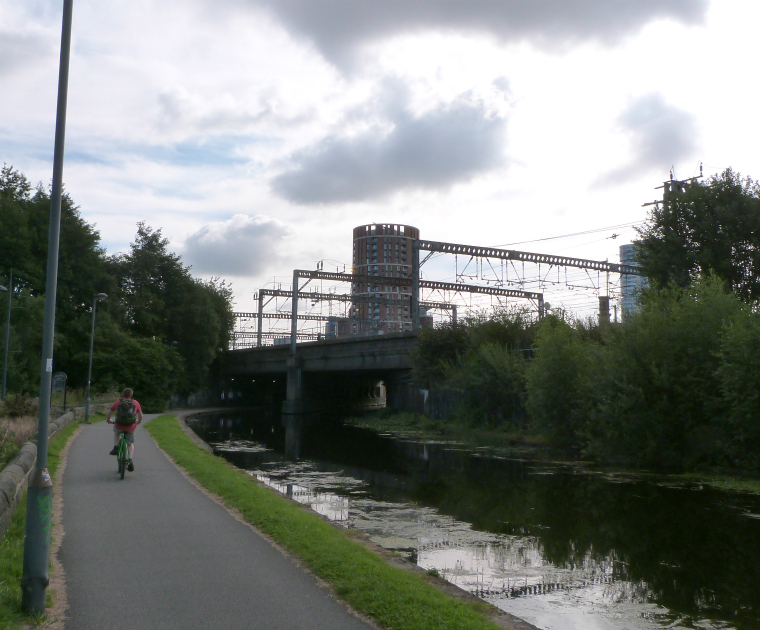 Cyclist on canal towpath near Leeds