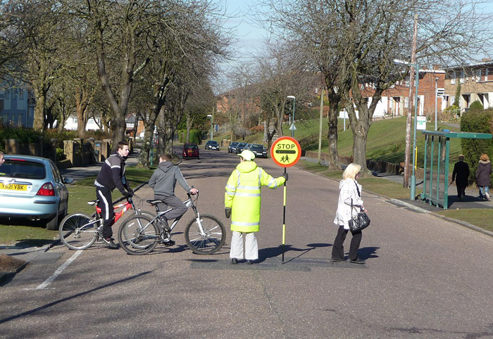 Lollipop lady and crossing in Bournemouth, by Lewis Clarke, Licence CC BY-SA 2.0