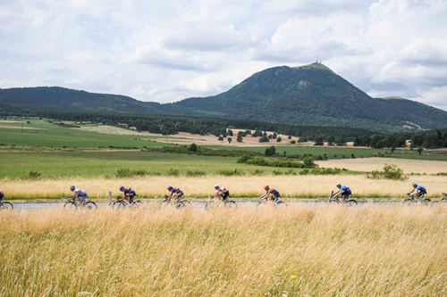 Riders passing the Puy de Dome on Stage 10 TDF 2025, by A.S.O./Charly Lopez
