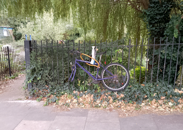 Chained-up bicycle with front wheel missing